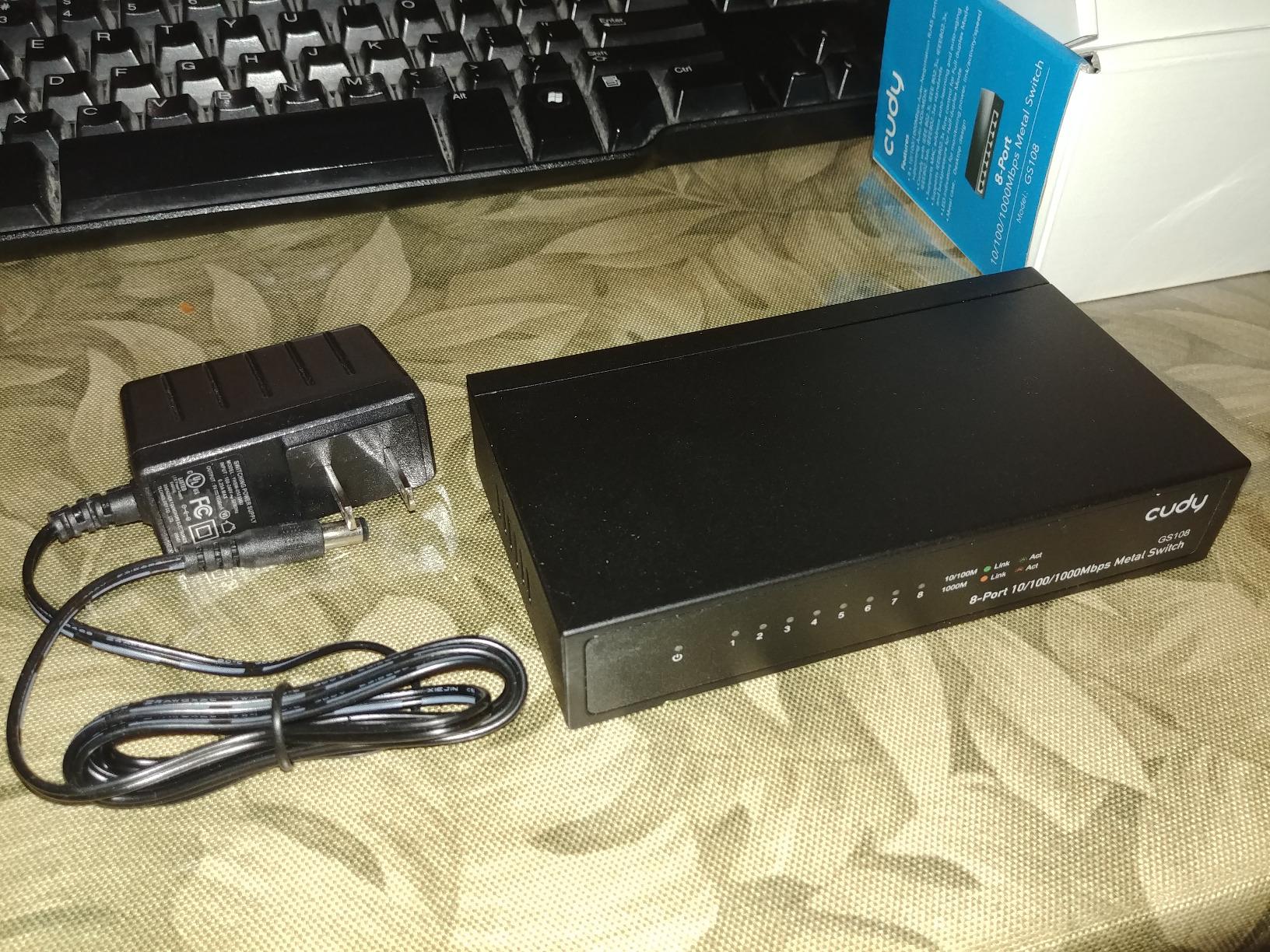 GS108 8 Port Gigabit Unmanaged Ethernet Network Switch, Ethernet Splitter Plug & Play Fanless Metal Design Shielded Ports Traffic Optimization customer photo 1