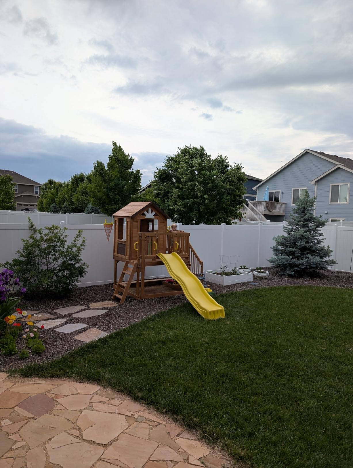 Backyard Discovery Scenic Heights Elevated Cedar Wooden Kids Playhouse with Play Kitchen, Wrap-Around Deck, Toy Storage Bench, Saloon-Style Doors, Ladder, Stairs, and Growth Chart for Outdoor Play customer photo 1