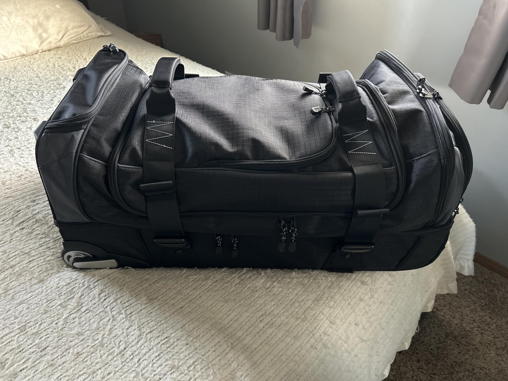 Amazon Basics 35-Inch Large Rolling Duffel Bag for Travel with Wheels and Handle, Durable Ripstop Polyester, 2 Layers of Space, Multiple Interior and Exterior Pockets, Blue customer photo 1